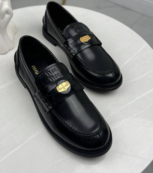 Лоферы Miu Miu женский кожа черный 199452