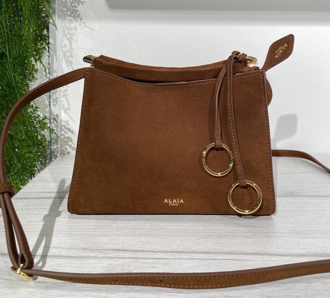 Сумка Alaïa женский кожа бежевый 194409
