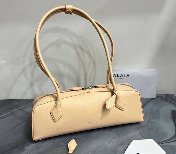 Сумка Alaïa женский кожа бежевый 152510