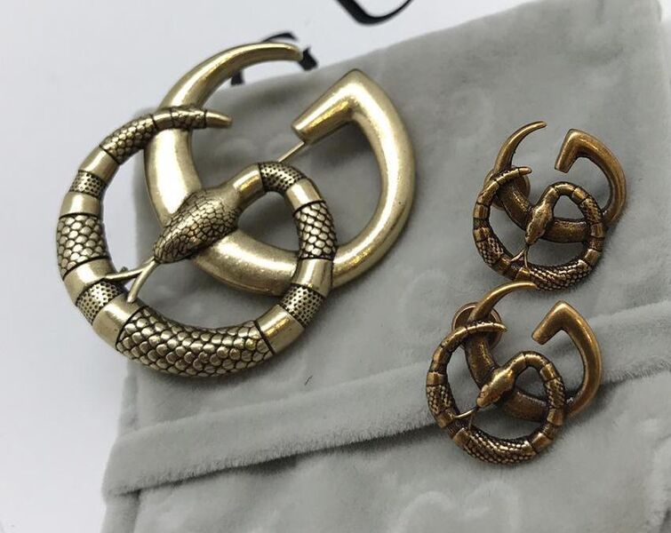 Брошь Gucci бронзовый 10504